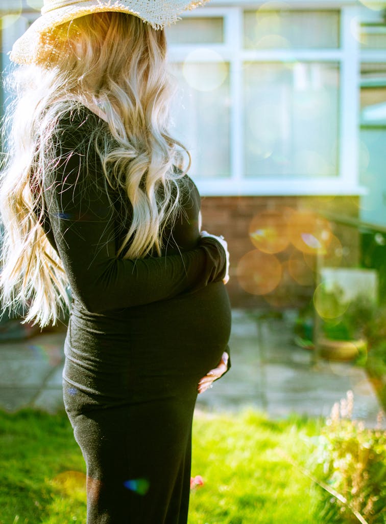 Pregnant Woman Holding Own Tummy